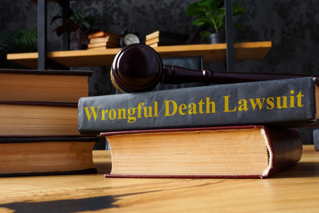 Pile of books with "wrongful death lawsuit" written on spine