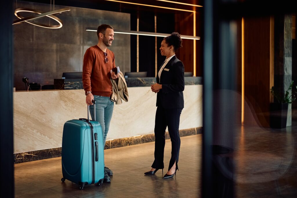 hotel guest talking with hotel concierge